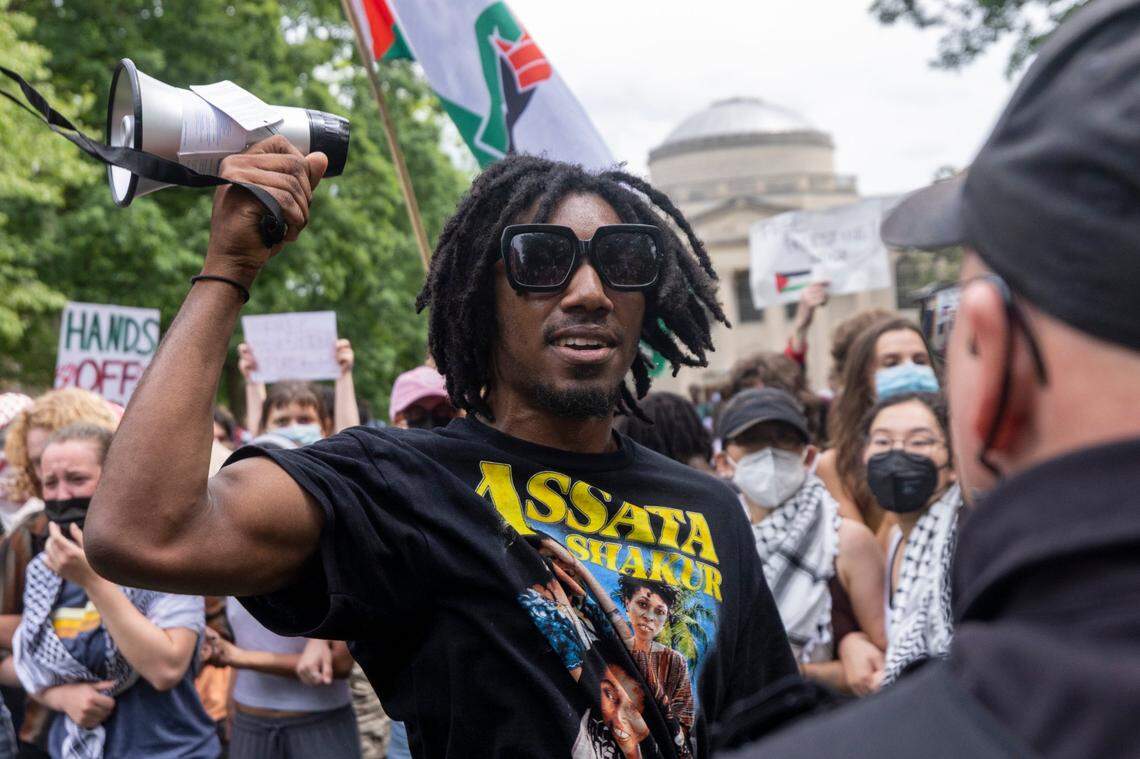 Pro-Palestinian demonstrators clash with police after replacing an American flag with a Palestinian flag Tuesday, April 30, 2024 at UNC-Chapel Hill. Police removed a “Gaza solidarity encampment” earlier Tuesday morning.