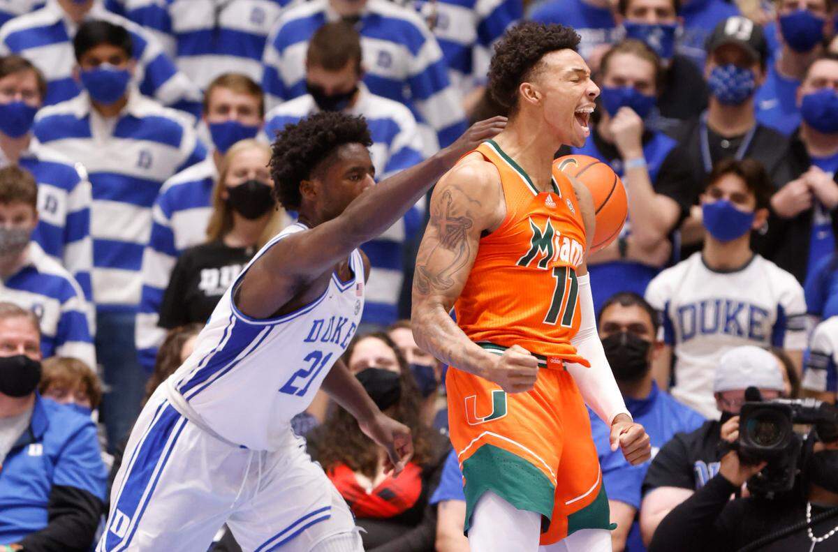 Miami’s Jordan Miller (11) celebrates after slamming in two during the second half of Miami’s 76-74 victory over Duke at Cameron Indoor Stadium in Durham, N.C., Saturday, January 8, 2022. Duke’s A.J. Griffin (21) is to the left.