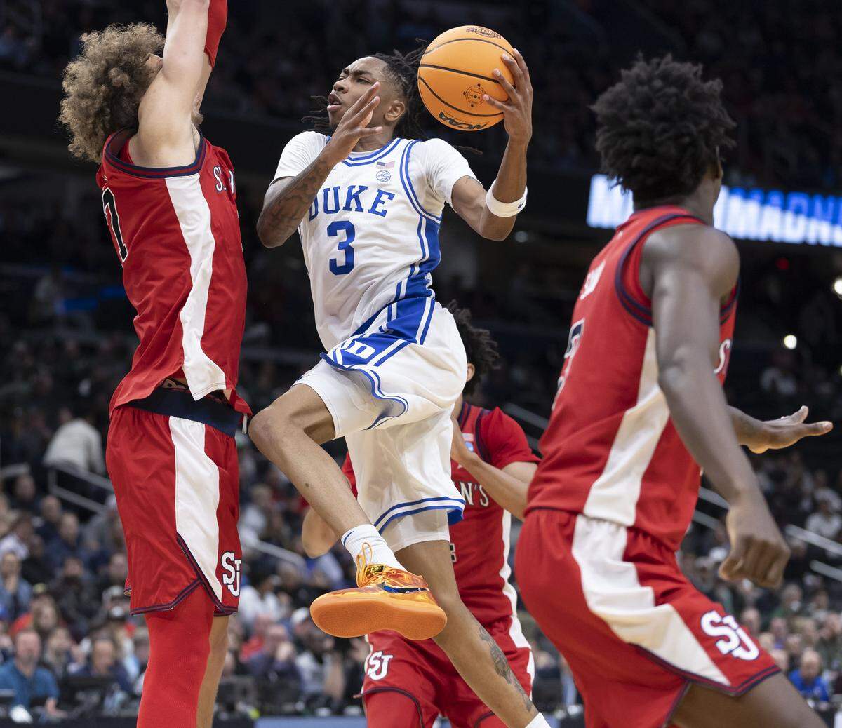 Duke forward Isaiah Evans (3) drives to the basket against St. John’s forward Ruben Prey (17) during the first half on Friday, March 27, 2026, during the Sweet Sixteen of the NCAA Tournament at Capital One Arena in Washington, D.C.