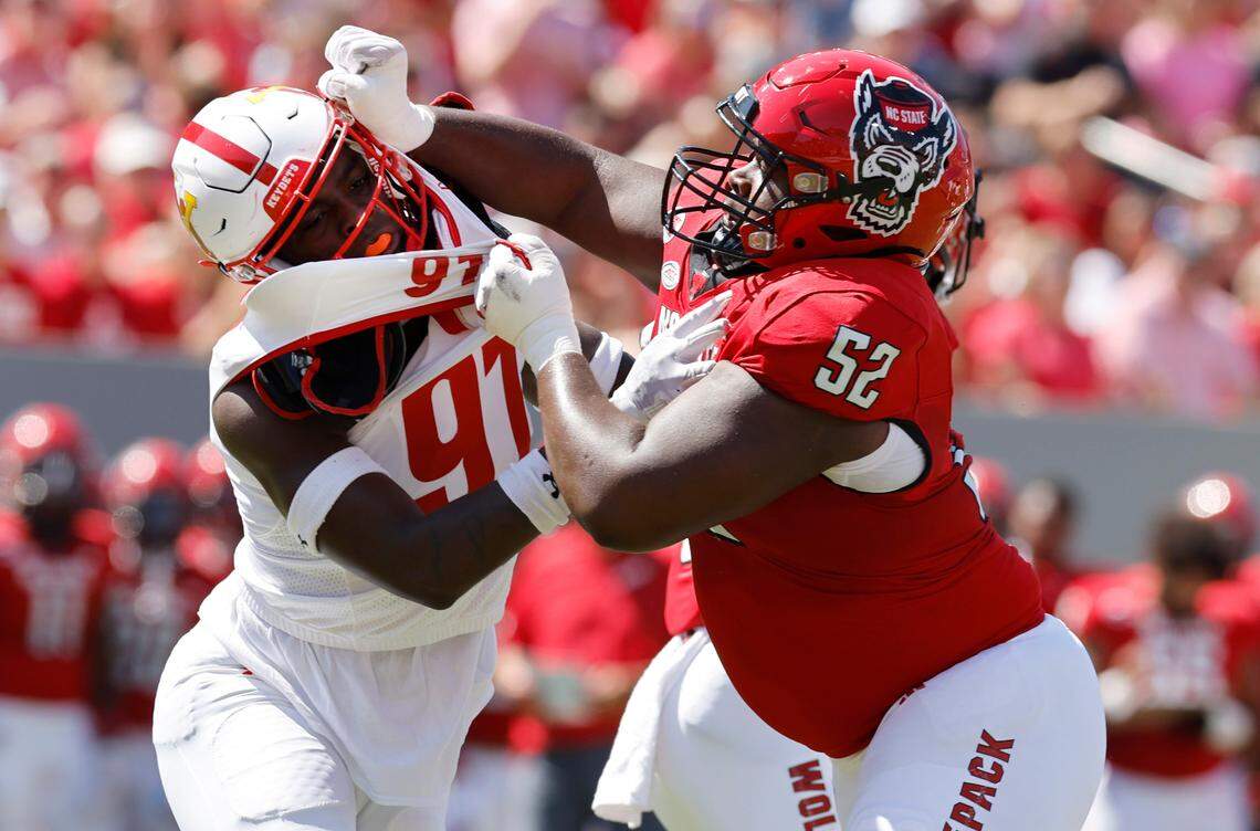 N.C. State offensive lineman Timothy McKay (52) blocks Virginia Military Institute defensive lineman Geoffrey Speight (97) during the first half of N.C. State’s game against VMI at Carter-Finley Stadium in Raleigh, N.C., Saturday, Sept. 16, 2023.