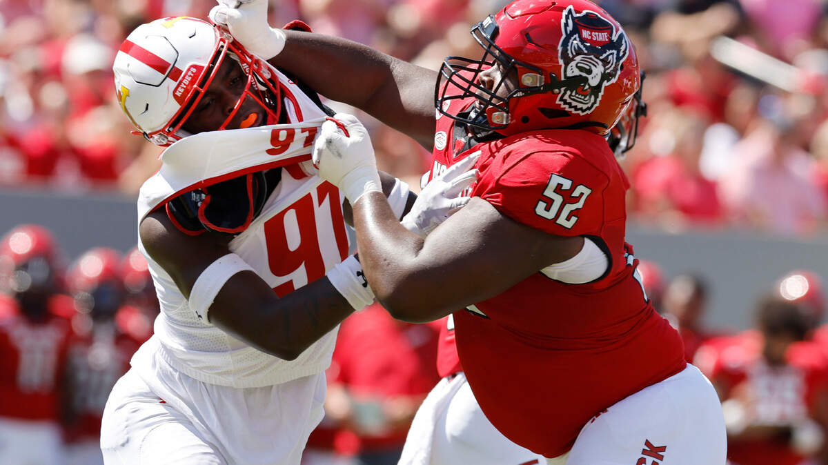N.C. State offensive lineman Timothy McKay (52) blocks Virginia Military Institute defensive lineman Geoffrey Speight (97) during the first half of N.C. State’s game against VMI at Carter-Finley Stadium in Raleigh, N.C., Saturday, Sept. 16, 2023.