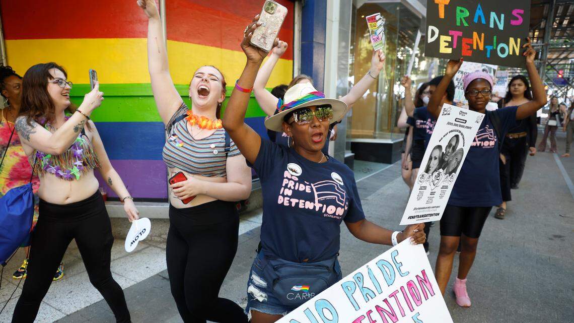 Tania Jiménez, 39, of Asheboro, center, participates in a march in downtown Raleigh, N.C., Saturday, June 25, 2022, to protest House Bill 755, the “Parents’ Bill of Rights,” and bring awareness to the conditions trans immigrants face in detention.