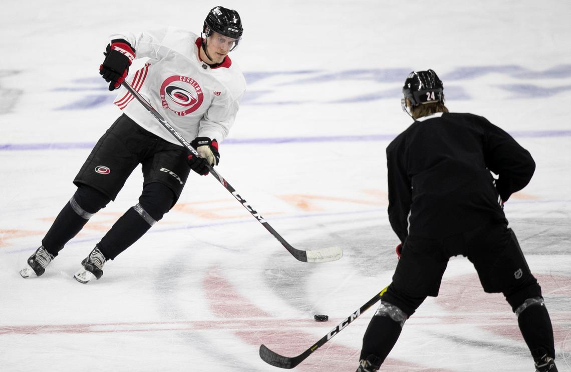Carolina Hurricanes’ Saku Maenalanen (8) moves the puck against Jake Bean (24) during practice on Monday, May 13, 2019 at PNC Arena in Raleigh, N.C.