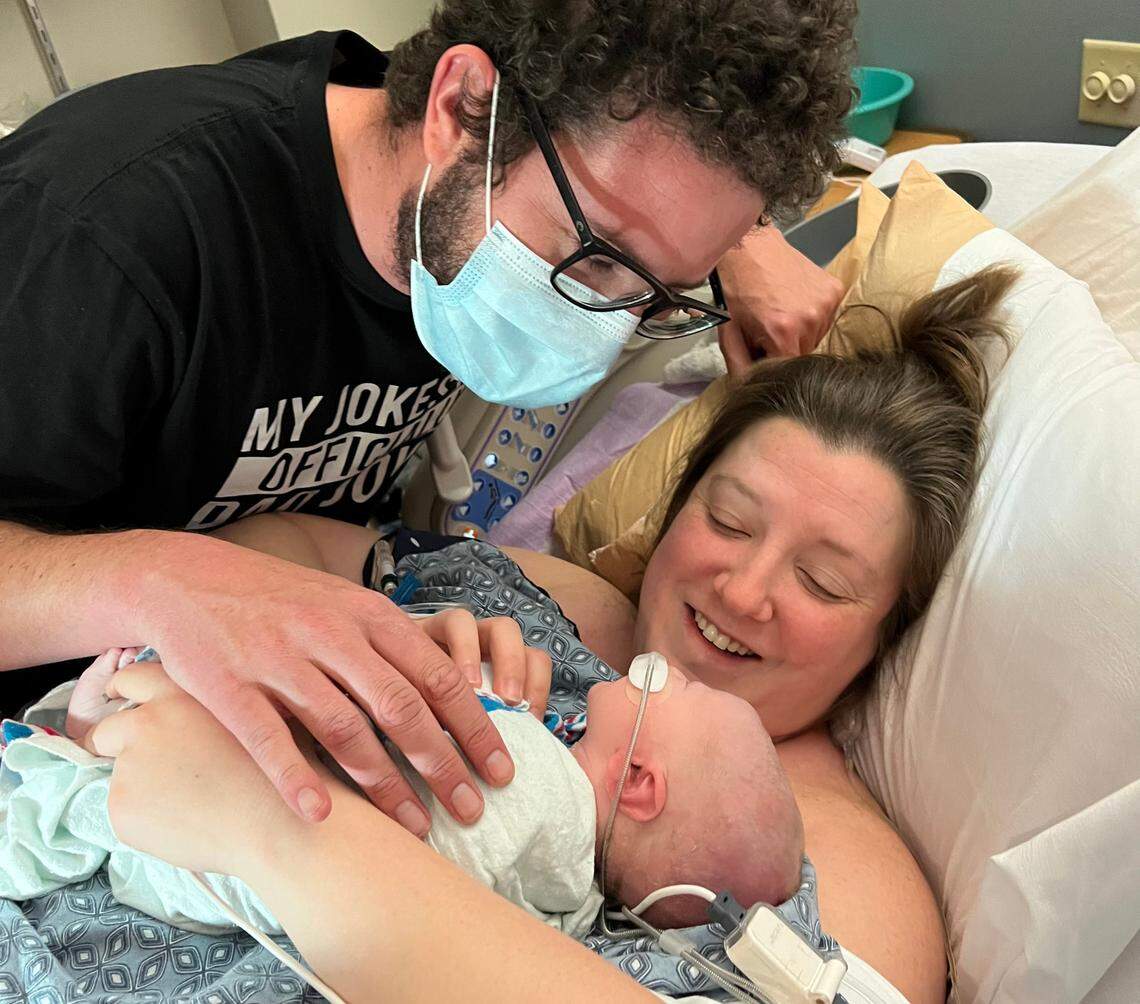 Owen Monroe is held by his parents Tayler and Nick just after he was born in April 2022.