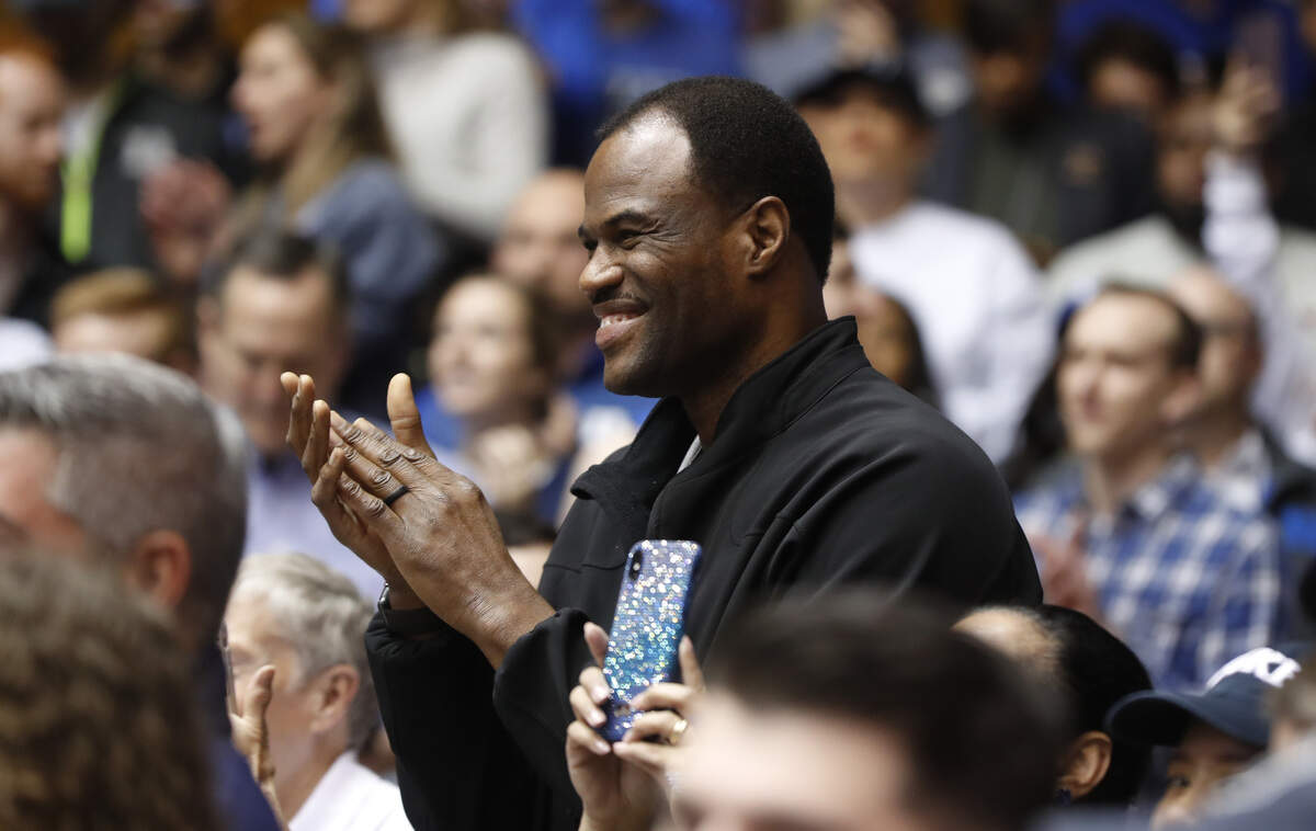 David Robinson, father of Duke’s Justin Robinson, applauds as Justin is recognized before the North Carolina Tar Heels’ game against the Duke Blue Devils at Cameron Indoor Stadium in Durham, N.C., Saturday, March 7, 2020.