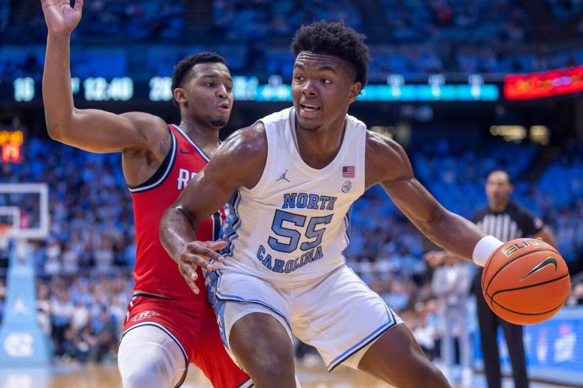 North Carolina’s Harrison Ingram (55) works his way to the basket against Radford’s Daquan Smith (1) in the first half on Monday, November 6, 2023 at the Dean Smith Center in Chapel Hill, N.C.