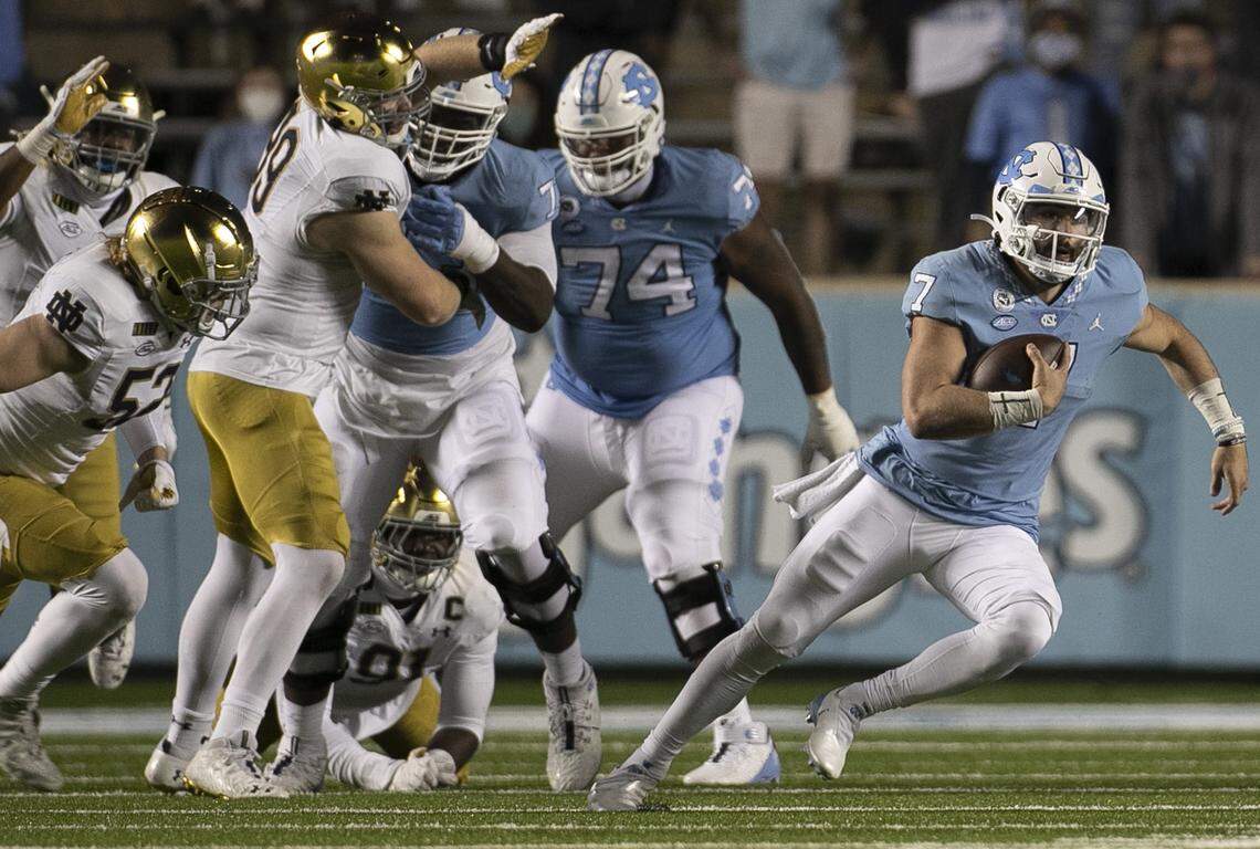North Carolina quarterback Sam Howell (7) breaks open for a five-day gain in the fourth quarter against Notre Dame on Friday, November 27, 2020 at Kenan Stadium in Chapel Hill, N.C. Howell ran the ball 11 times and only had a net gain of two yards.