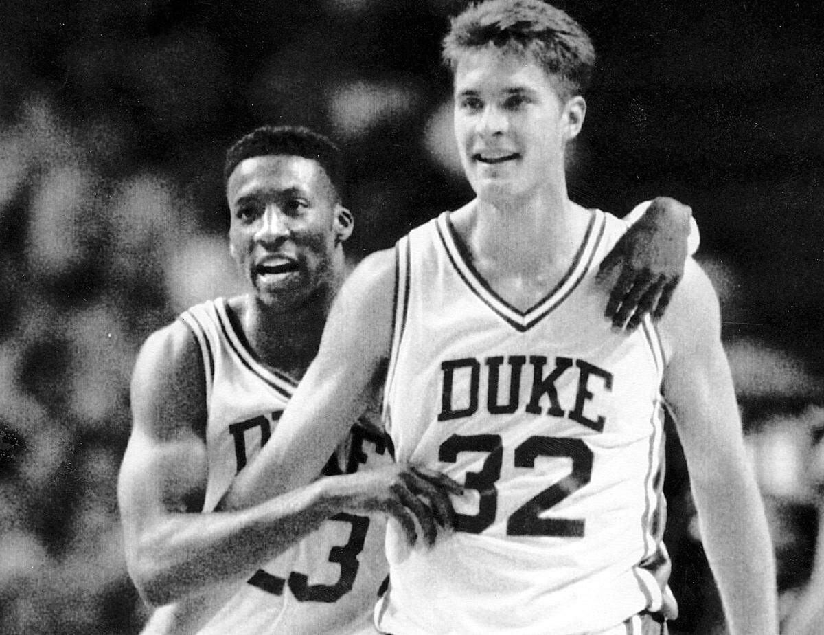 Duke's Brian Davis, left, embraces teammate Christian Laettner after Blue Devils defeated Georgia Tech in the 1992 ACC tournament.