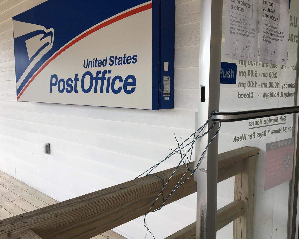 The door of the Ocracoke Post Office is tied open so customers don’t have to touch it on their way in or out. The post office is one of a handful of places left for islanders to go with most businesses closed during the coronavirus scare.