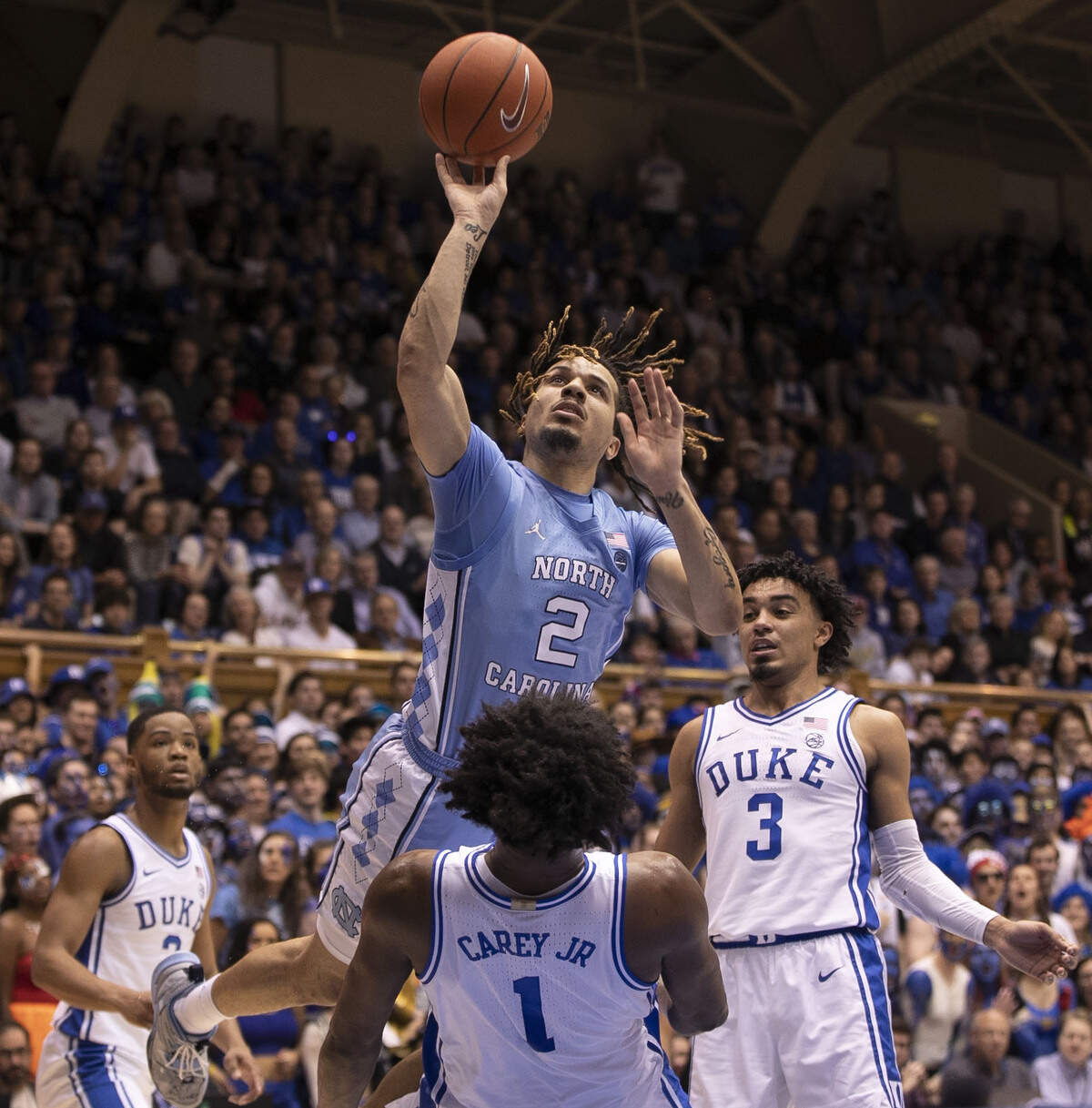 North Carolina’s Cole Anthony (2) collides with Duke’s Vernon Carey Jr. (1) during the first half on Saturday, March 7, 2020 at Cameron Indoor Stadium in Durham, N.C. Anthony was called for charging.
