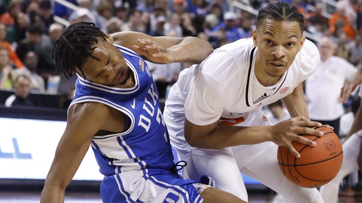 Miami’s Isaiah Wong fouls Duke’s Jeremy Roach during the first half of Duke’s game against Miami in the semifinals of the ACC Men’s Basketball Tournament in Greensboro, N.C., Friday, March 10, 2023.
