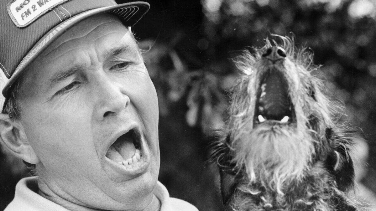A 1977 photo shows Dan McLamb and his dog Percy, competing in the National Hollerin’ Contest in Spivey’s Corner, N.C..