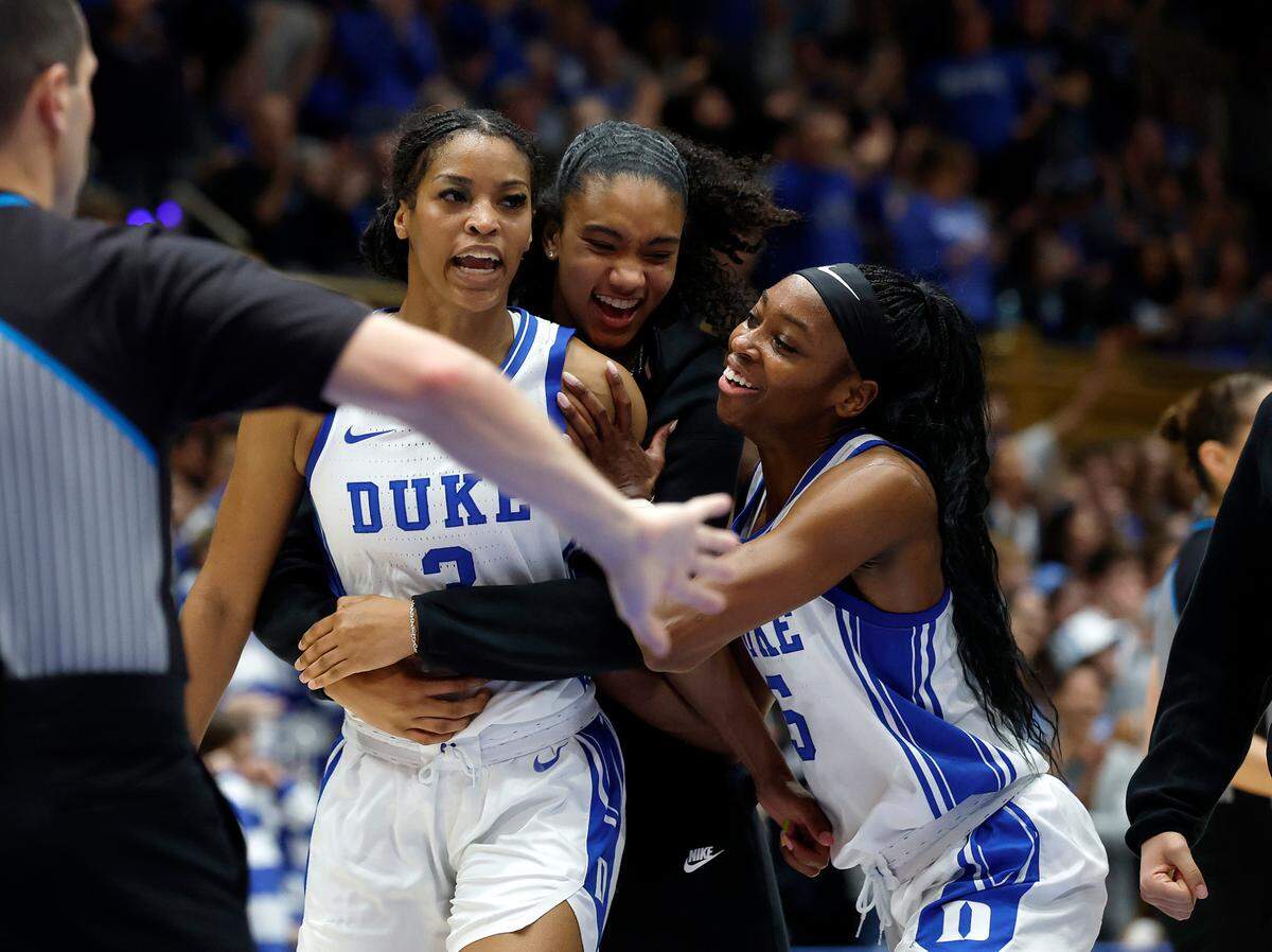 Teammates react after Duke’s Ashlon Jackson (3) knocked down a basket during the second half of the Blue Devils’ 68-53 win over North Carolina on Thursday, Feb. 27, 2025, at Cameron Indoor Stadium in Durham, N.C.