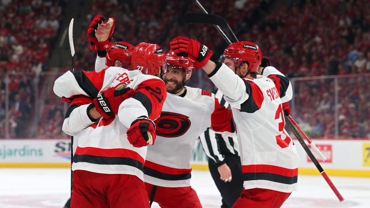 Sebastian Aho #20 of the Carolina Hurricanes celebrates with teammates after scoring a goal against the Montreal Canadiens during the first period in Game Four of the Eastern Conference Final of the 2026 Stanley Cup Playoffs at Bell Centre on May 27, 2026 in Montreal, Quebec, Canada. 