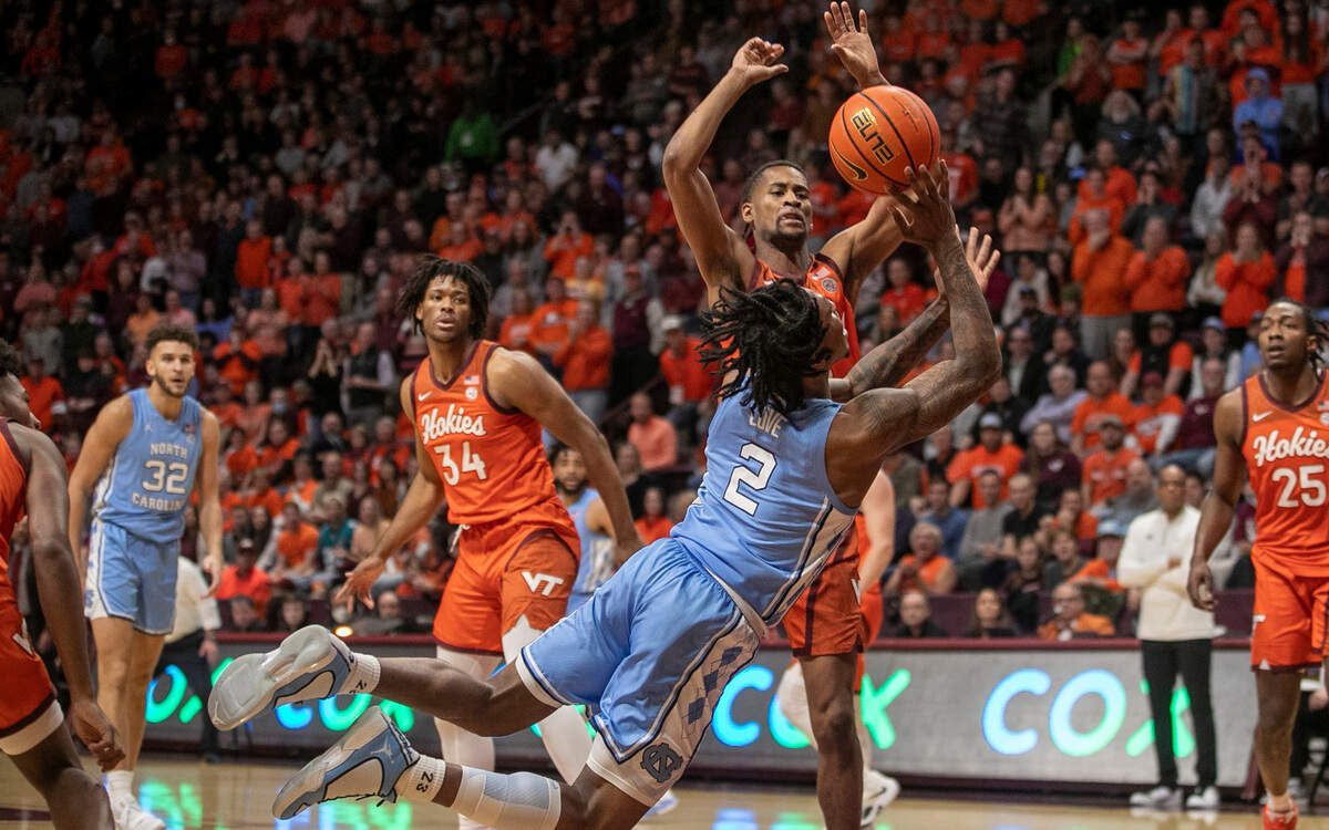 Virginia Tech’s Darius Maddox (13) defends North Carolina’s Caleb Love (2) during the second half on Sunday, December 4, 2022 at Cassell Coliseum in Blacksburg, Va. North Carolina dropped their fourth game in a row falling to Virginia Tech 80-72.