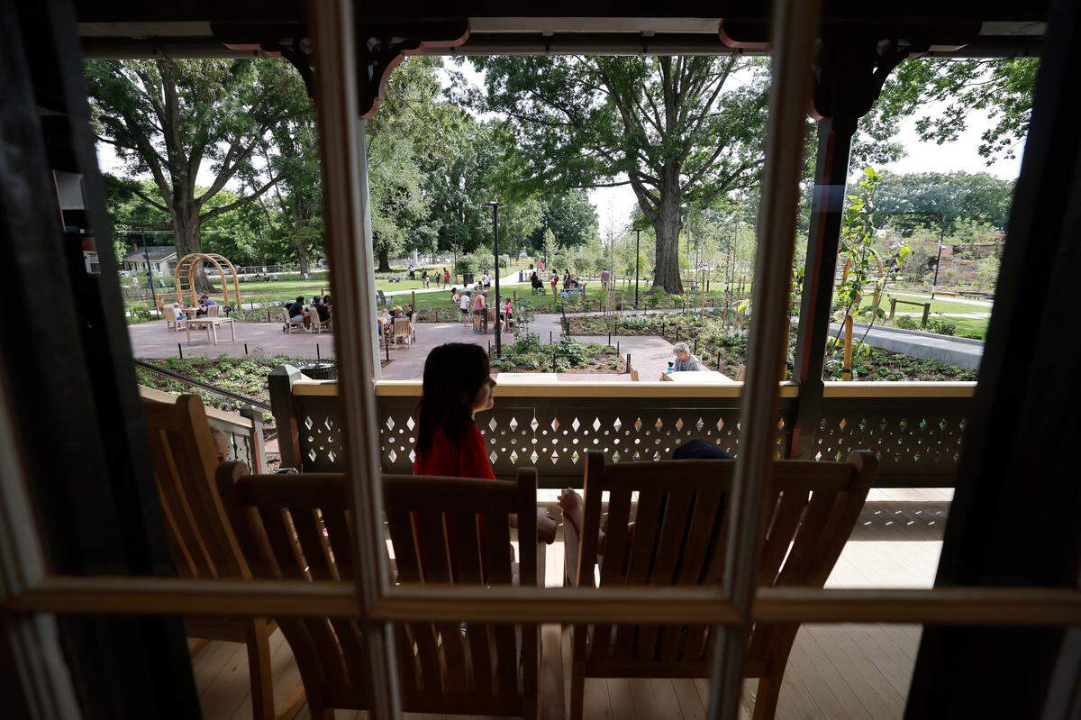 The House of Many Porches Market at Gipson Play Plaza at Dix Park has rocking chairs and areas to sit and relax. Photographed during a preview day Saturday, May 24, 2025.