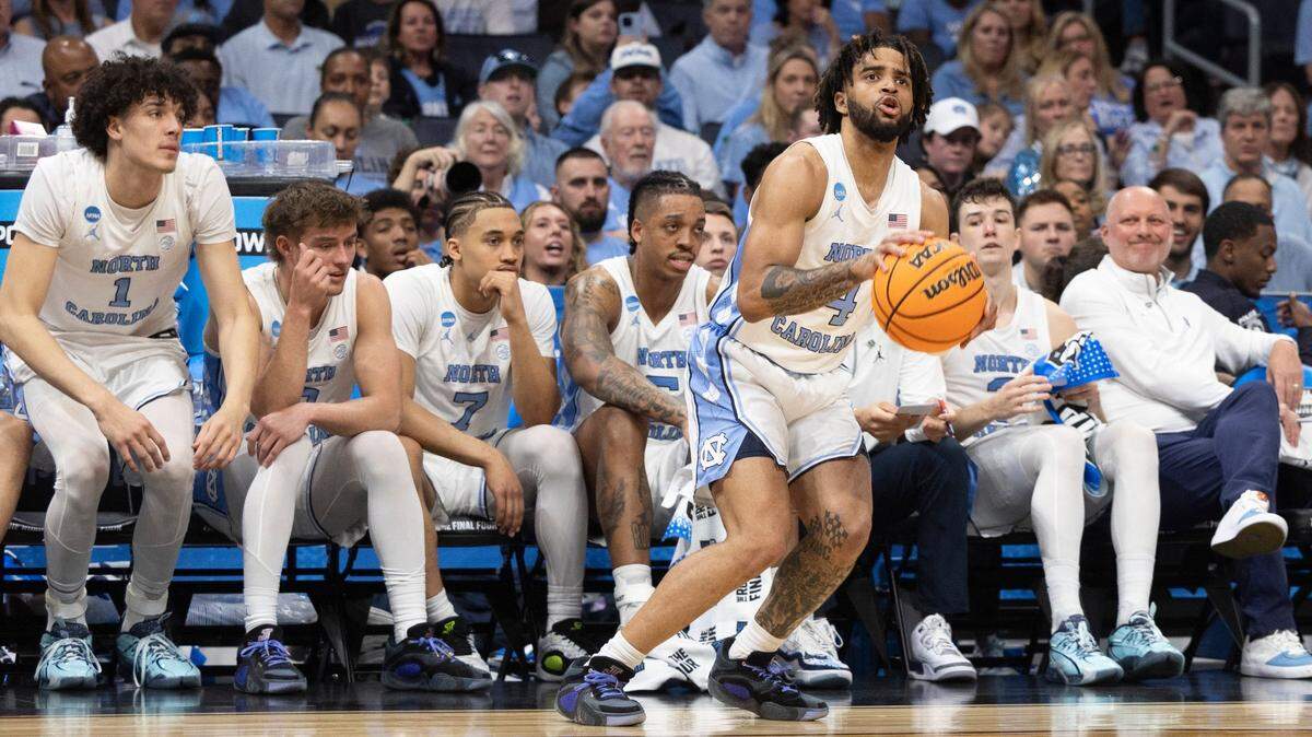 North Carolina’s R.J. Davis (4) sets up for a three point attempt in front of the the Tar Heels’ bench in the second half against Wagner on Thursday, March 21, 2024 during the NCAA Tournament at Spectrum Center in Charlotte, N.C.
