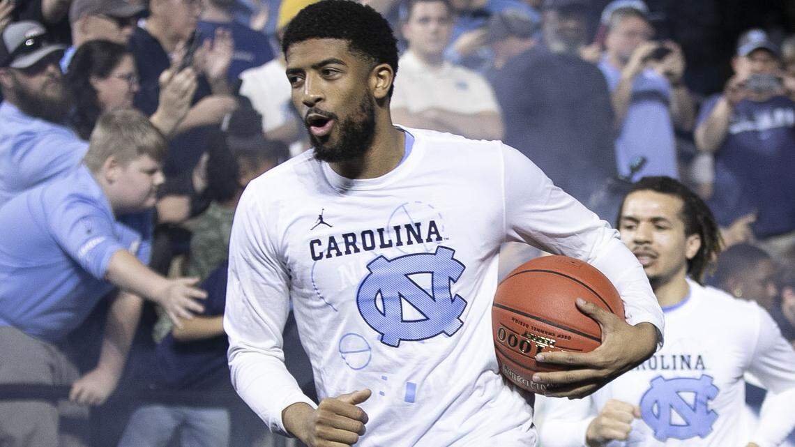 North Carolina’s K.J. Smith (30) leads the Tar Heels into the Greensboro Coliseum for their first round ACC tournament game against Virginia Tech on Tuesday, March 10, 2020 in Greensboro, N.C.