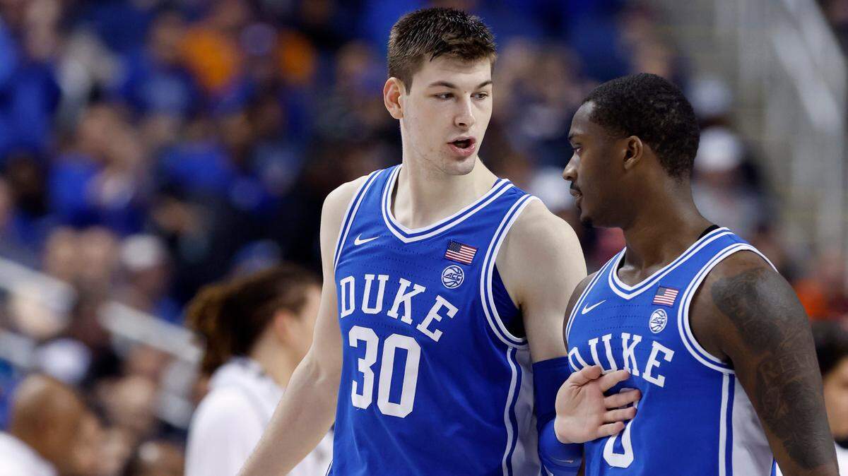 Duke’s Kyle Filipowski (30) talks with Dariq Whitehead (0) during the second half of Duke’s 85-78 victory over Miami in the semifinals of the ACC Men’s Basketball Tournament in Greensboro, N.C., Friday, March 10, 2023.