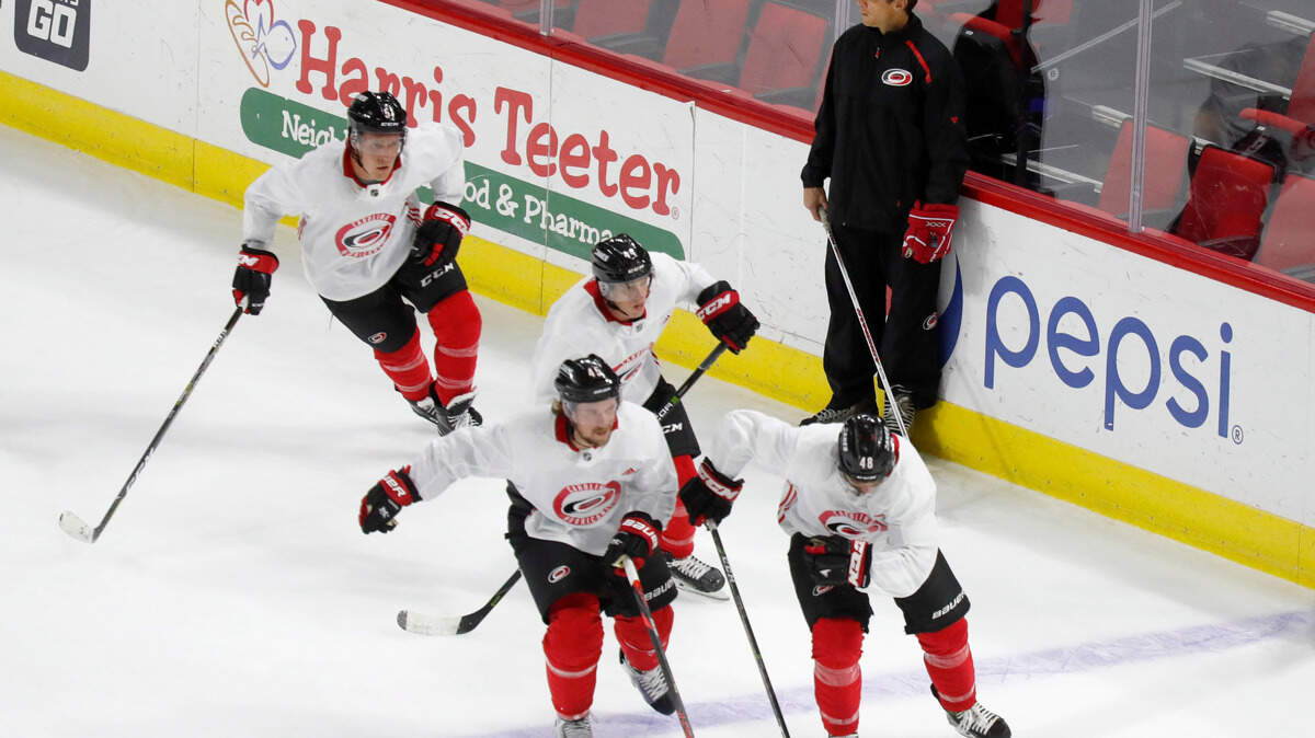 Carolina head coach Rod Brind’Amour watches as players run drills during the Carolina Hurricanes’ practice at PNC Arena in Raleigh, N.C., Wednesday, July 22, 2020.