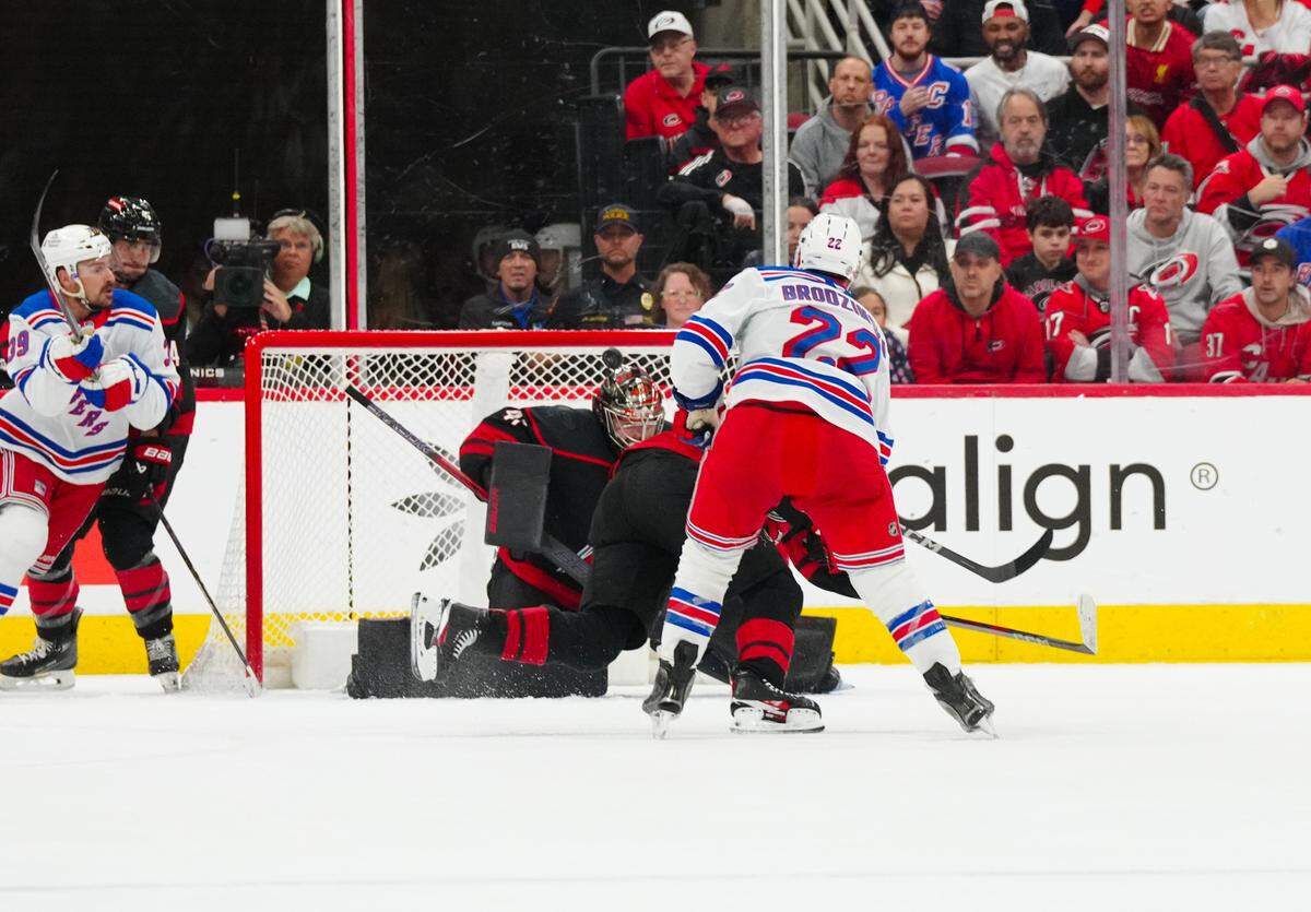 New York Rangers center Jonny Brodzinski (22) scores a goal past Carolina Hurricanes goaltender Spencer Martin (41) during the first period at Lenovo Center.