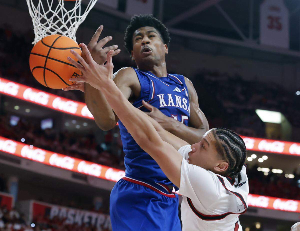 N.C. State’s Matt Able battles Kansas’ Bryson Tiller for a rebound during the second half of the Wolfpack’s 77-76 overtime loss on Saturday, Dec. 13, 2025, at Lenovo Center in Raleigh, N.C.