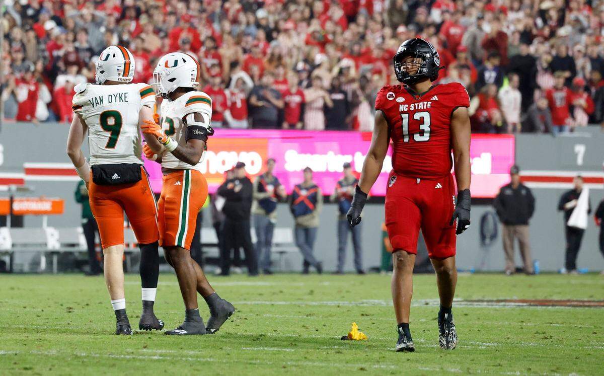 N.C. State defensive end Travali Price (13) reacts after he was called for roughing the passer during the first half of N.C. State’s game against Miami at Carter-Finley Stadium in Raleigh, N.C., Saturday, Nov. 4, 2023.
