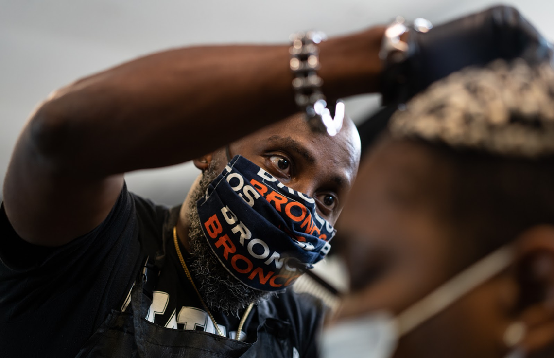 Derick Cagle cuts a client’s hair at Gentlemen Quarters Barbershop, in Durham, NC. Photo taken on November 10, 2021.