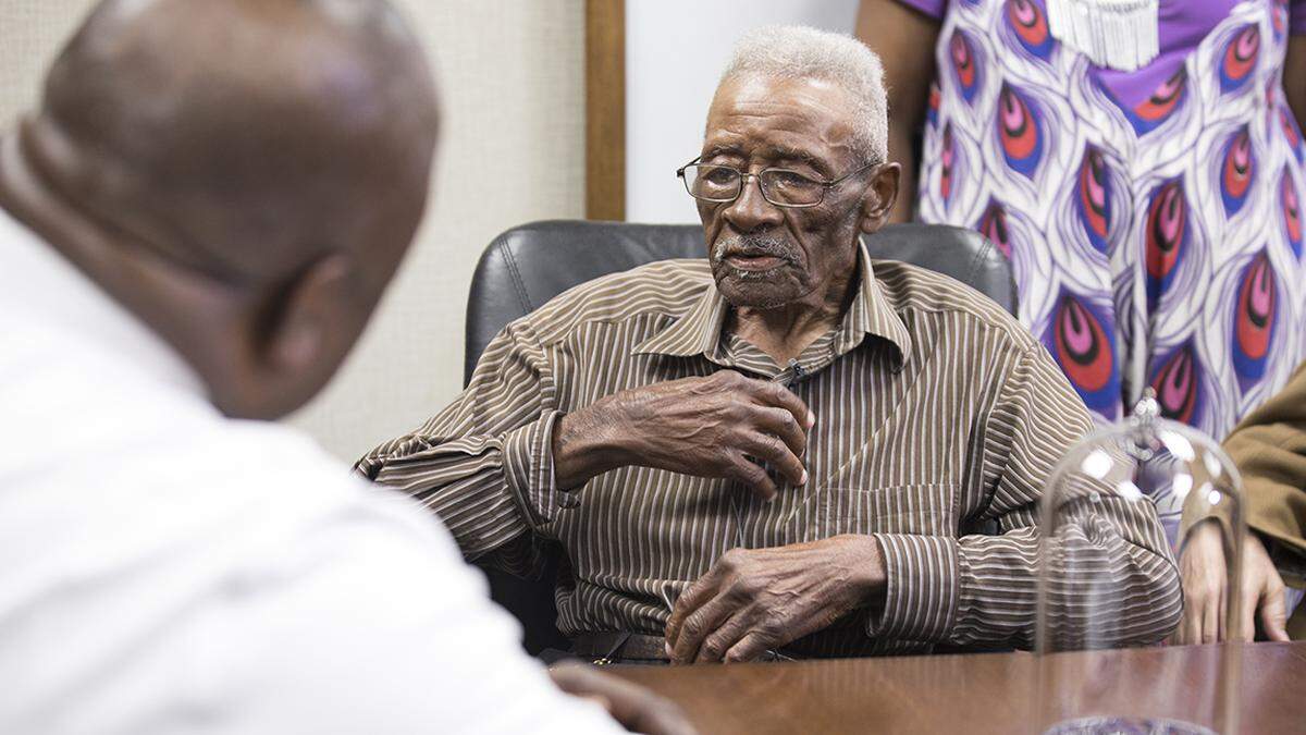 Lynn Council speaks to Sheriff Gerald Baker after Baker officially apologized to him on behalf of the sheriff’s office for an incident that occurred in Apex in 1952 in which sheriff’s deputies try to lynch Council so he’d confess to a crime. Council was given a key to the sheriff’s office and a capsule engraved with a bible verse on Thursday, June 13, 2019. Baker has also removed from the halls of the office a photograph of Sheriff Robert Pleasants, who held office in 1952.