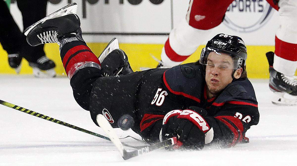 Carolina Hurricanes’ Erik Haula (56) dives to the ice during the first period of the team’s NHL hockey game against the Detroit Red Wings in Raleigh, N.C., Friday, Nov. 1, 2019. (AP Photo/Karl B DeBlaker)
