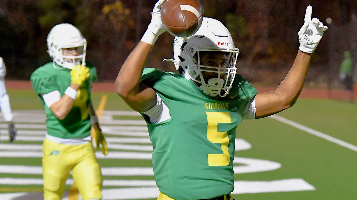 Cardinal Gibbons running back Kendall Scotton (5) celebrates his touchdown against Hillside during the first half. The Cardinal Gibbons Crusaders and the Durham Hillside Hornets met in the third round of the NCHSAA 4A playoffs in Raleigh, N.C. on November 29, 2024.