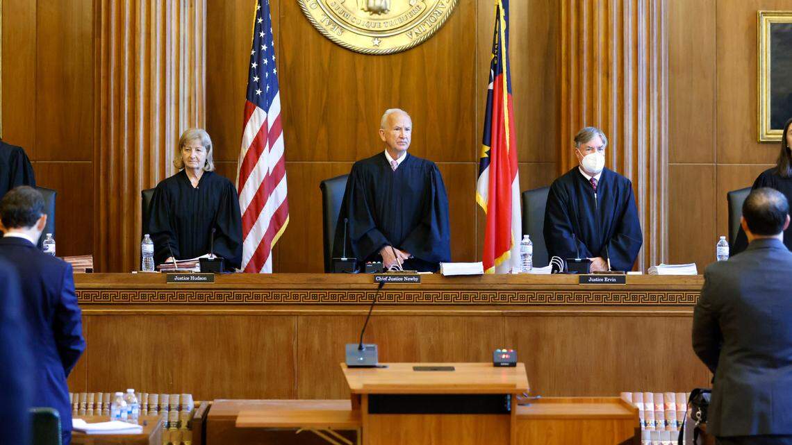 In this file photo, the North Carolina Supreme Court, including from left, Associate Justices Michael Morgan, Robin Hudson, Chief Justice Paul Newby and Associate Justices Samuel Ervin IV and Anita Earls, stand before recess in May 2022.