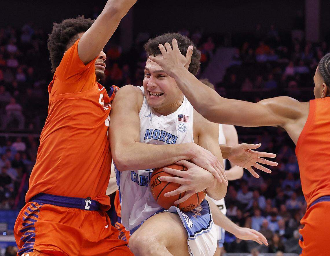 North Carolina's Luka Bogavac drives against Clemson's Efrem Johnson and Dillon Hunter during the second half of the Tar Heels’ 80-79 loss in the ACC Tournament quarterfinals on Thursday, March 12, 2026, at the Spectrum Center in Charlotte, N.C.