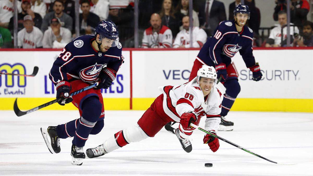 Carolina Hurricanes’ Teuvo Teravainen (86) dives at the puck controlled by Columbus Blue Jackets’ Oliver Bjorkstrand (28) in a 2019 game at PNC Arena in Raleigh. Teravainen played in only 21 games last season.
