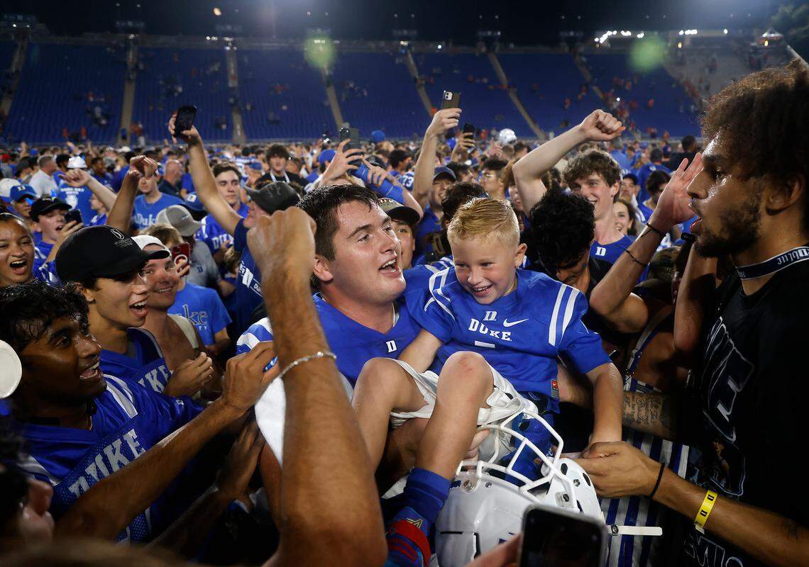 Duke players, students and fans celebrate on the field following the Blue Devils’ 28-7 win over Clemson on Monday, Sept. 4, 2023, at Wallace Wade Stadium in Durham, N.C.