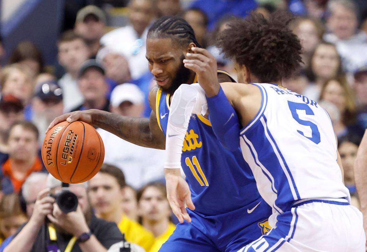 Duke’s Tyrese Proctor (5) defends Pittsburgh’s Jamarius Burton (11) during the second half of Duke’s game against Pitt in the quarterfinals of the ACC Men’s Basketball Tournament in Greensboro, N.C., Thursday, March 9, 2023.