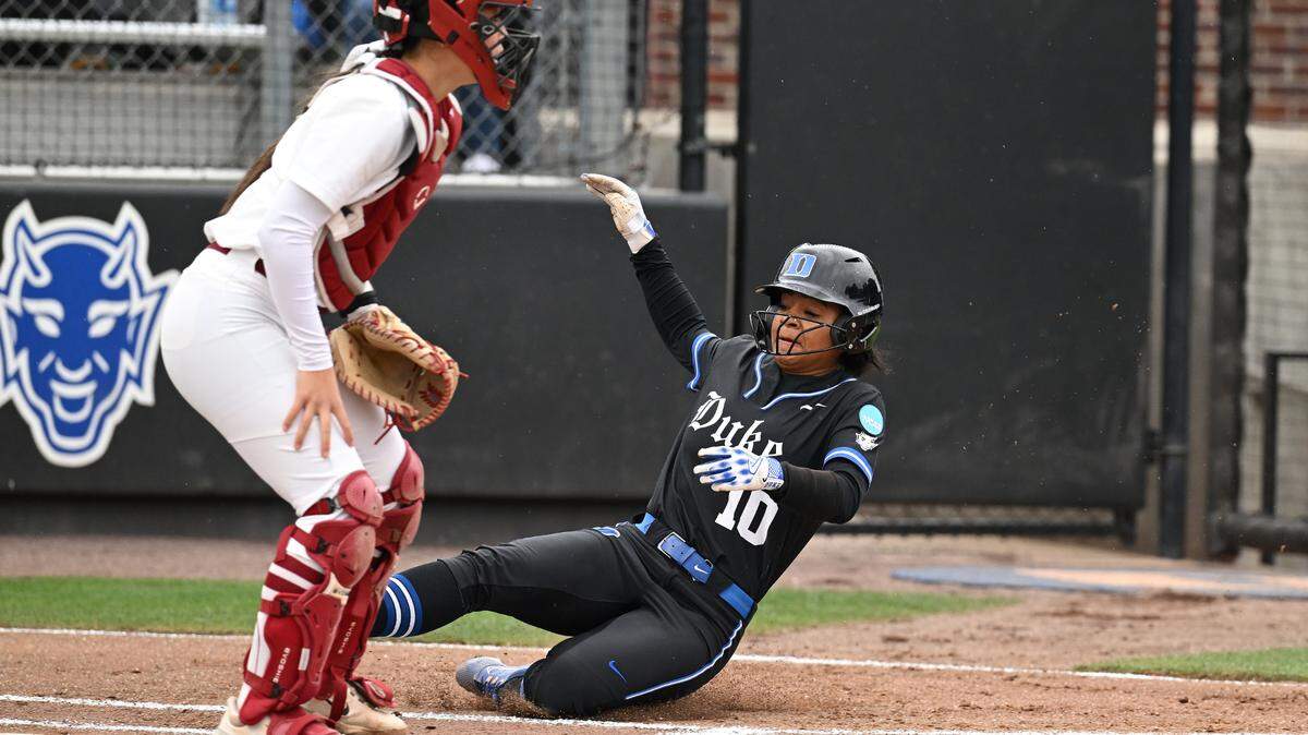 Duke softball’s D’Auna Jennings (10) slides home during the Blue Devils’ 7-2 loss to Stanford in game two of the NCAA Tournament Durham Super Regional on Saturday.