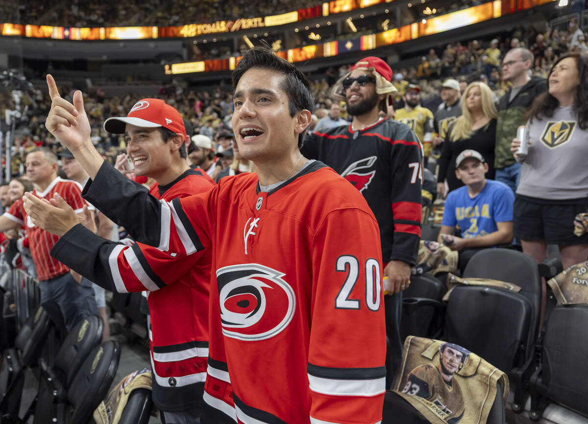 Carolina Hurricanes fans Thomas Kriston and John Kriston, from New York and San Francisco, cheer on the team, during pre-game warm ups ahead of Game 3 of the Stanley Cup Final against Vegas Golden Knights, on Saturday, June 6, 2026 at T-Mobile Arena in Las Vegas, NV.