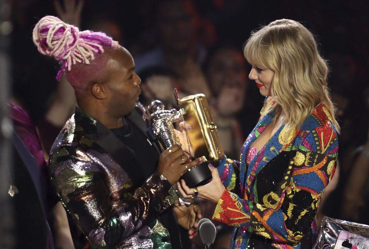 Todrick Hall, left, and Taylor Swift accept the Video for Good Award for “You Need to Calm Down” at the MTV Video Music Awards. Hall will perform at NC Pride at Night in Raleigh Sept. 28.