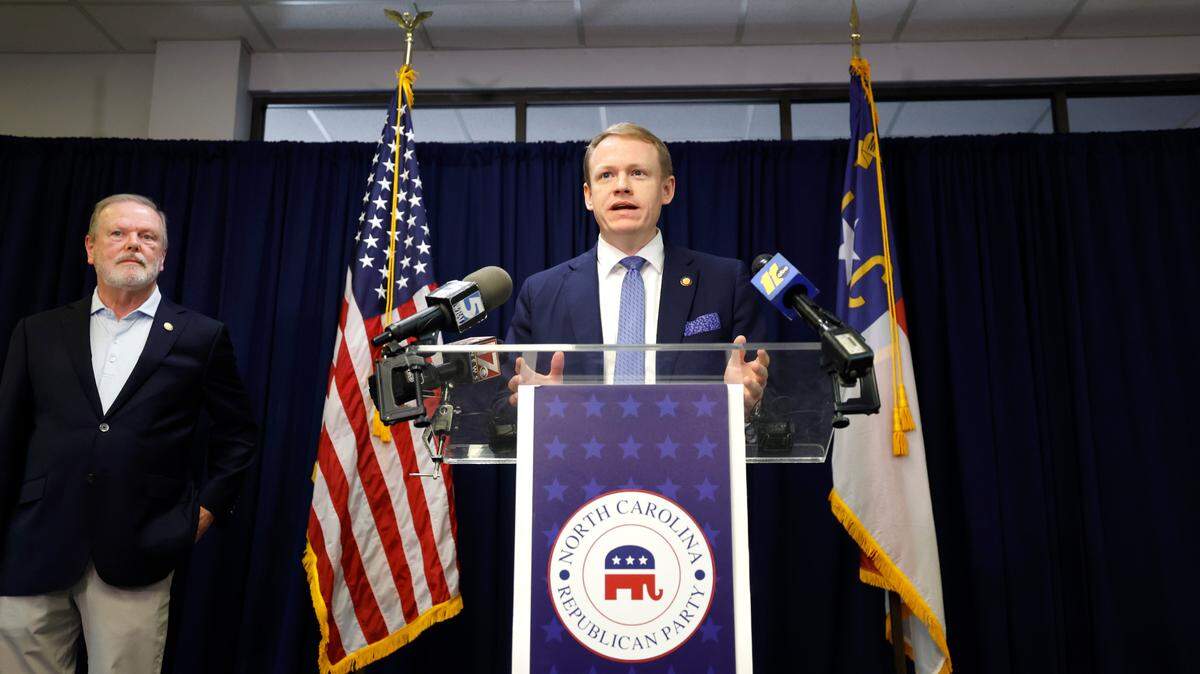 Rep. Destin Hall speaks during a press conference at the N.C. Republican Party headquarters in Raleigh, N.C., Wednesday, Nov. 6, 2024. N.C. Senate leader Phil Berger stands to the left.