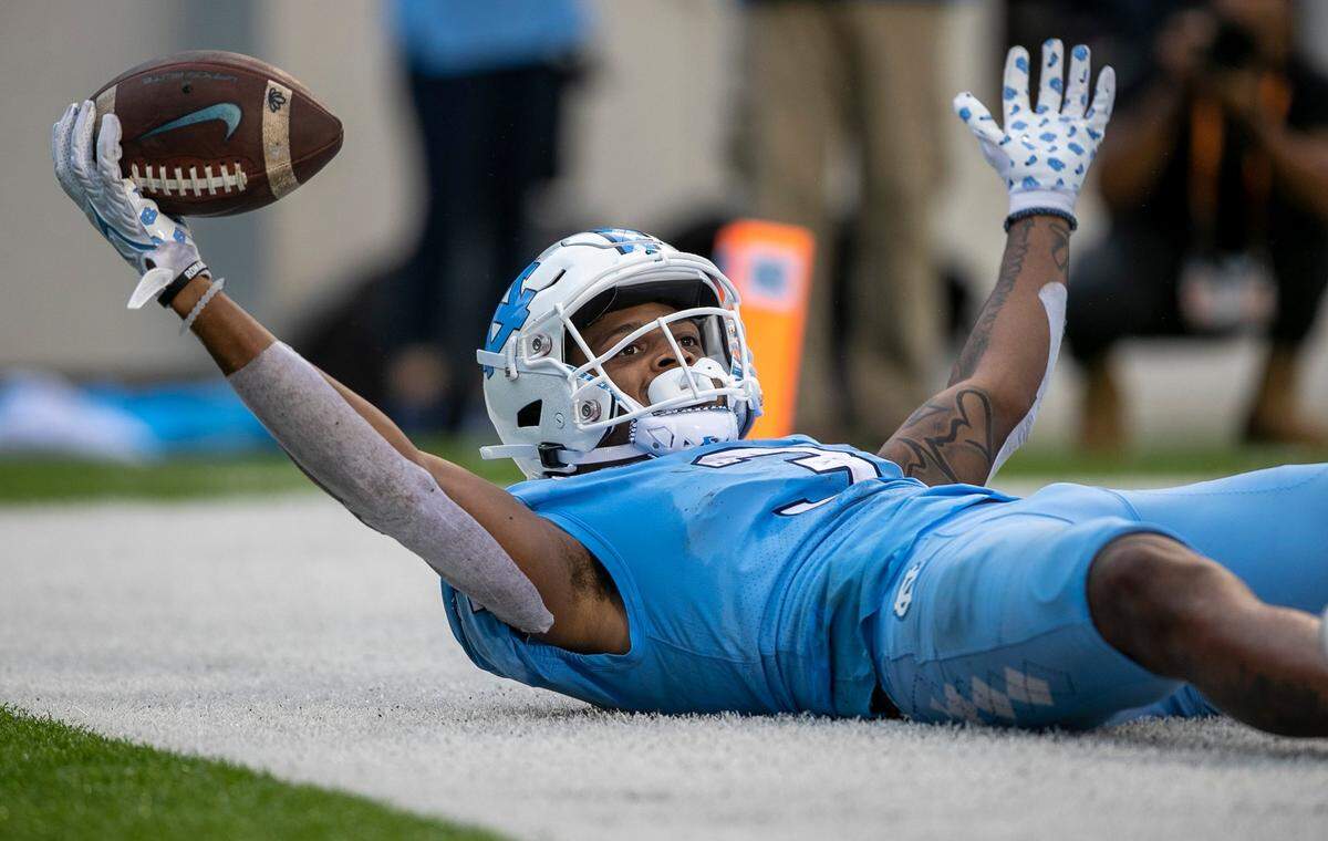 North Carolina’s Antonie Green (3) reacts after scoring a touchdown on a 16-yard reception from quarterback Drake Maye (10) to give the Tar Heels’ a 21-3 lead over Virginia Tech on Saturday, October 1, 2022 at Kenan Stadium in Chapel Hill, N.C.