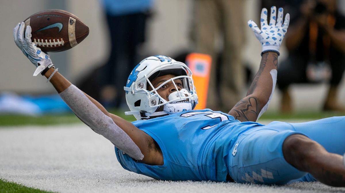 North Carolina’s Antonie Green (3) reacts after scoring a touchdown on a 16-yard reception from quarterback Drake Maye (10) to give the Tar Heels’ a 21-3 lead over Virginia Tech on Saturday, October 1, 2022 at Kenan Stadium in Chapel Hill, N.C.