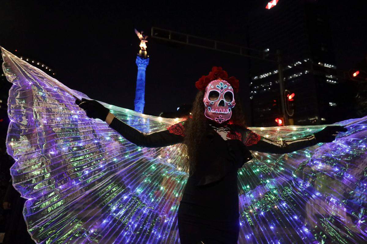 People dressed as “Catrinas” parade down Mexico City’s iconic Reforma avenue during celebrations ahead of the Day of the Dead in Mexico, Sunday, Oct. 22, 2023.&nbsp;