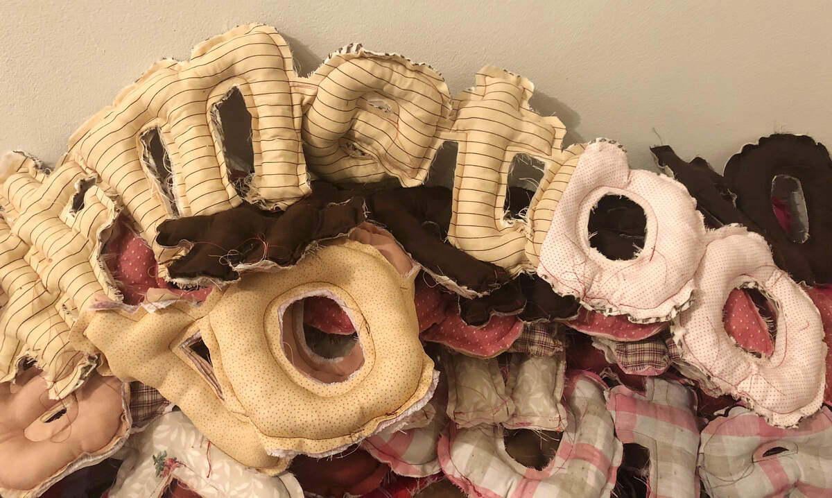 Klein created several #MeToo soft sculptures that are lying on the floor in a pile. During First Friday, visitors can help stuff the pieces with recycled fabric. At the end of the exhibition, Klein will give the sculptures away.