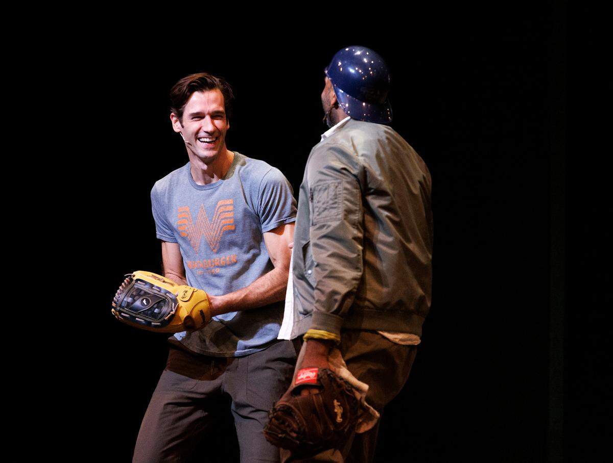 John Behlmann, playing the role of Nuke, and Nik Walker, playing the role of Crash, share a smile during a rehearsal of “Bull Durham” the musical on Thursday, Sept. 12, 2024, at Reynolds Industries Theater on Duke University campus.