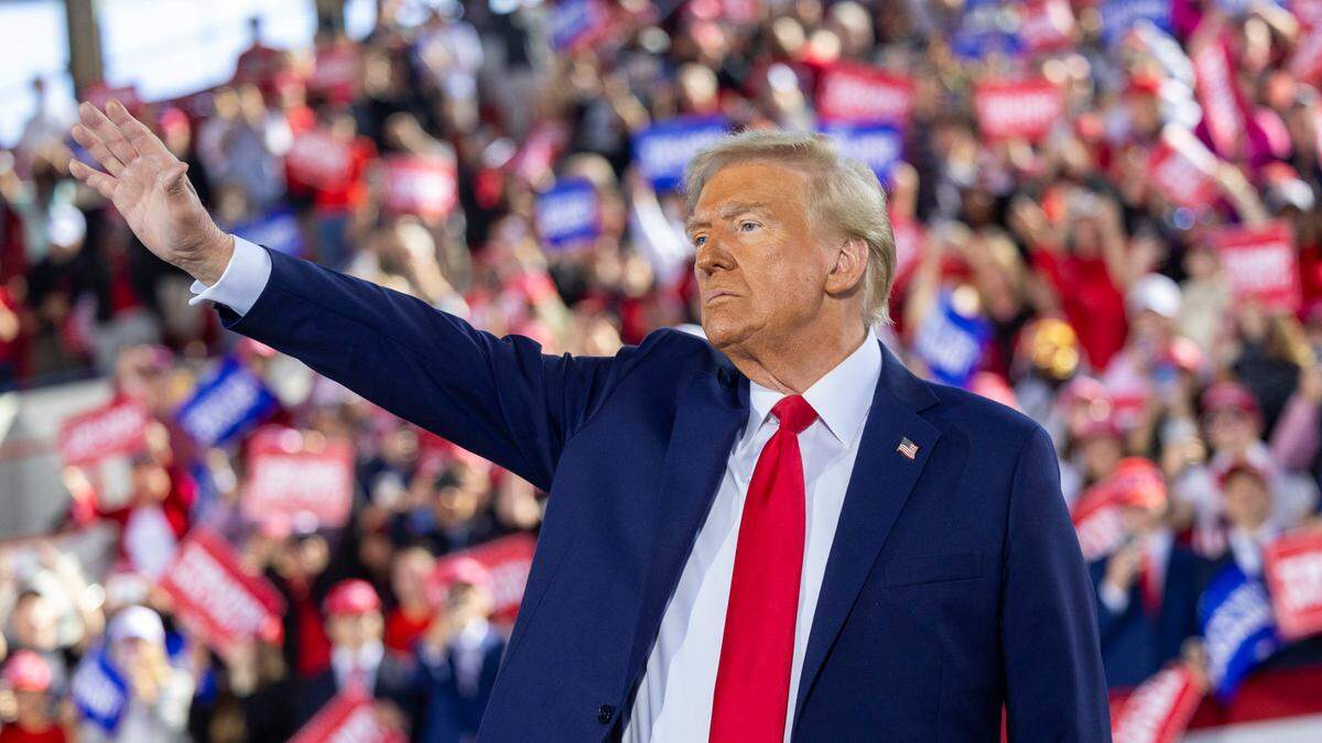 Republican presidential nominee and former President Donald Trump leaves the stage following a rally at Dorton Arena in Raleigh on Monday, Nov. 4, 2024, one day before Election Day.