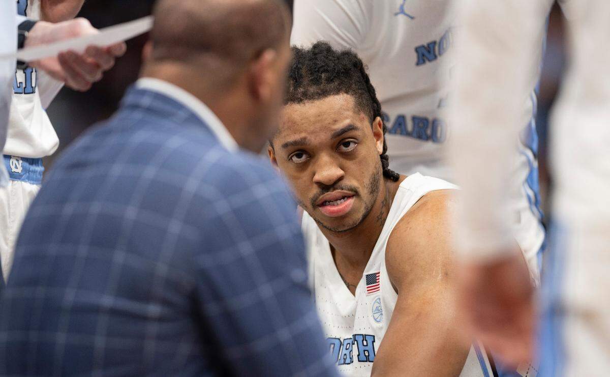 North Carolina coach Hubert Davis has the attention of Armando Bacot (5) during a time out in the first half against N.C. State in the ACC Men’s Basketball Tournament Championship at Capitol One Arena on Saturday, March 16, 2024 in Washington, D.C.