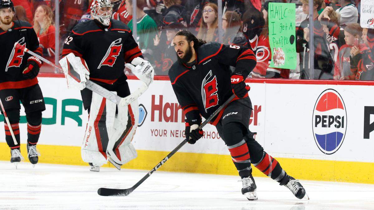 Carolina’s Jalen Chatfield (5) warms up before the Carolina Hurricanes’ game against the Florida Panthers in Game 2 of the Eastern Conference Final at the Lenovo Center in Raleigh, N.C., Thursday, May 22, 2025.