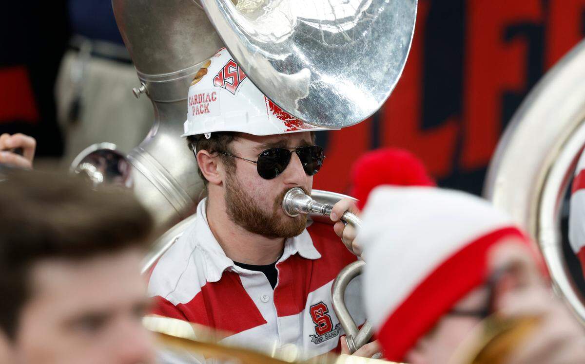 N.C. State pep band member Cooper Wood plays sousaphone during the Wolfpack’s practice at State Farm Stadium in Glendale, Ariz., Friday, April 5, 2024. The Wolfpack will face Purdue in the NCAA Tournament national semifinals Saturday.