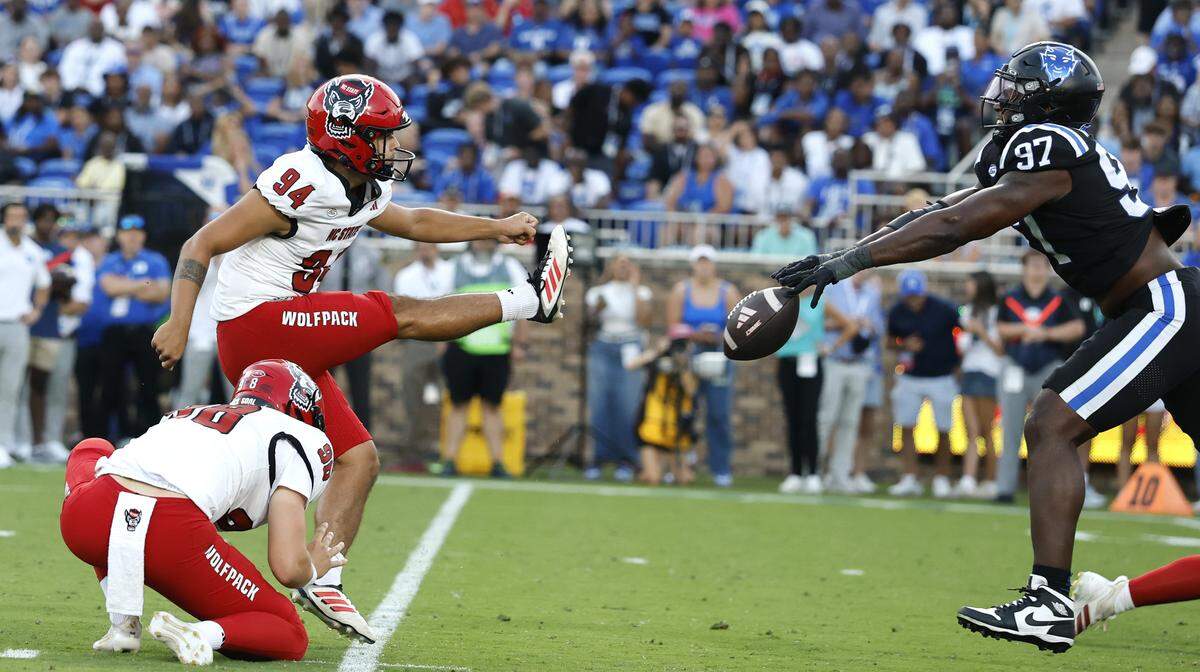 Duke’s Wesley Williams (97) blocks the field goal attempt by N.C. State’s Kanoah Vinesett (94) during the second half of Duke’s 45-33 victory over N.C. State at Wallace Wade Stadium in Durham, N.C., Sat. Sept. 20, 2025